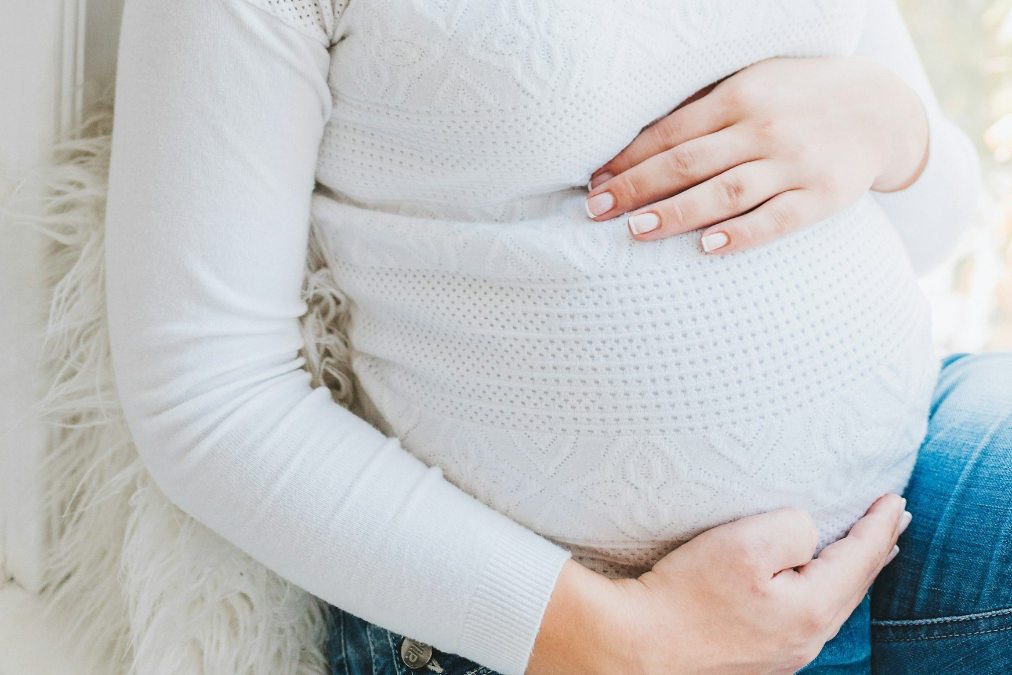 pregnant woman bonding with her bump